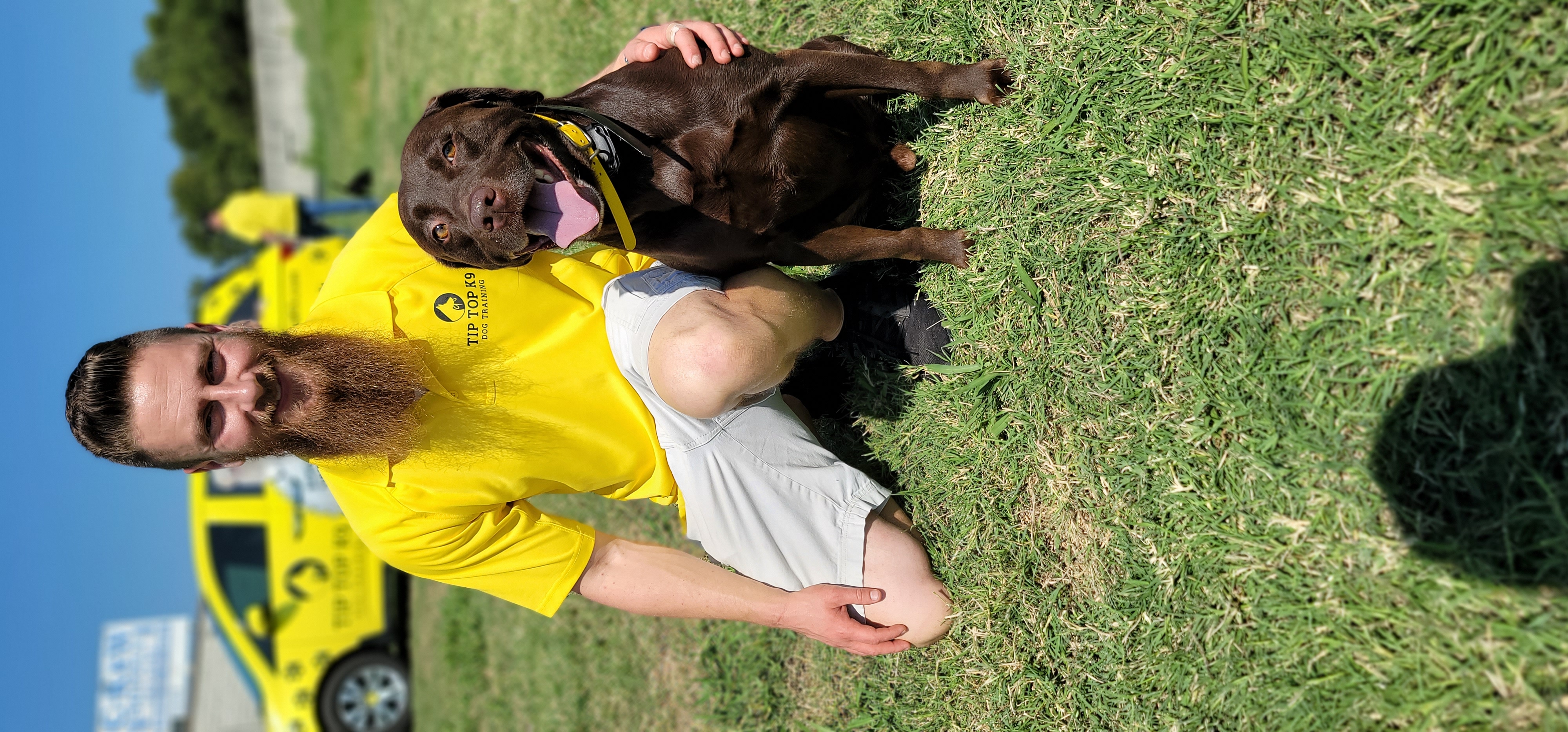 Ryan with a happy dog after a successful program